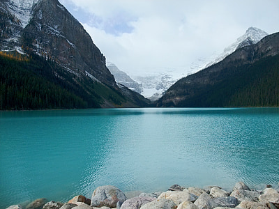 calm body of water between mountain alps thumbnail