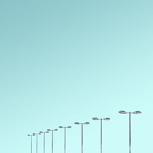 gray electric poles during daytime thumbnail