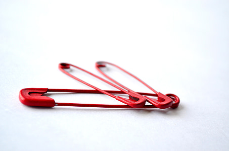 three red clothes pins thumbnail