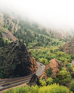 car travelling on road near the cliff thumbnail