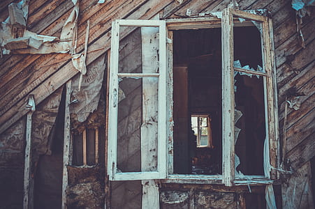 shattered glass window on brown wooden wall thumbnail