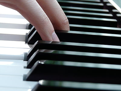 person's finger on piano keys thumbnail