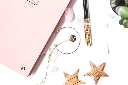 Silver-colored Open-end Bracelet Beside Two Brown Stars Ornament thumbnail