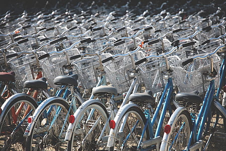 assorted-color commuter bike lot park thumbnail