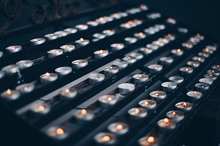 lighted candle lot close-up photography thumbnail