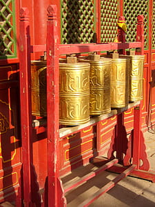 brass-colored prayer wheel with stand thumbnail