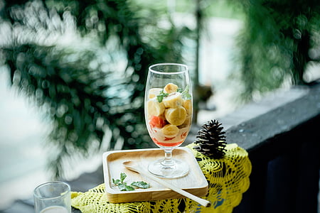 selective focus photography of fruit salad in wine glass thumbnail