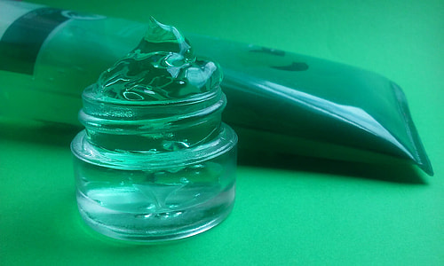 green cream jar on table thumbnail