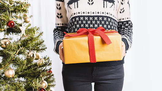 Young girl holds Christmas presents. Merry Christmas thumbnail