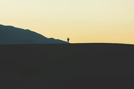 silhouette of person under gray sky during daytime thumbnail