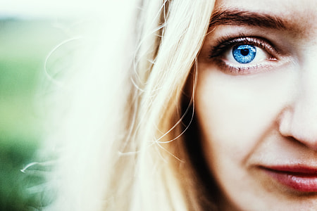 tilt lens photography of woman's face with blue eyes and blonde hair thumbnail