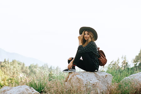 woman sitting on gray rock thumbnail
