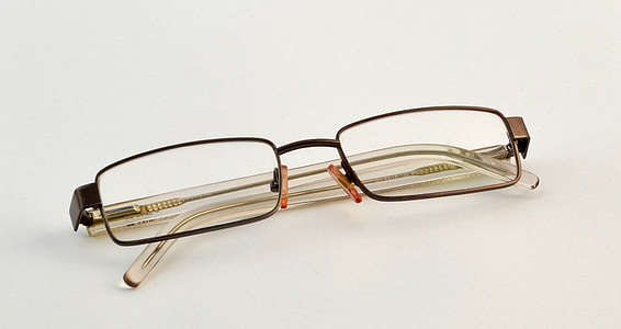 black framed eyeglasses placed on white surface thumbnail