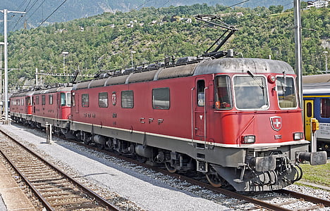 red cable train near mountains during daytime thumbnail