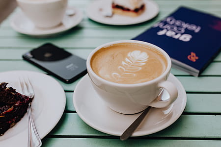 Drinking coffee and eating cake in a cafeteria thumbnail