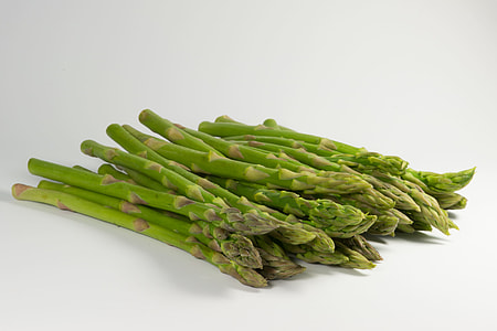 pile of green asparagus on white surface thumbnail