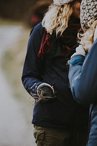 woman holding white flower thumbnail