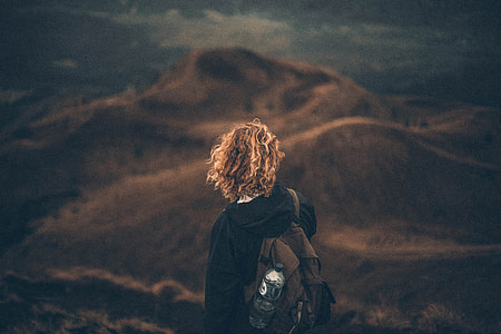 woman standing on mountain thumbnail