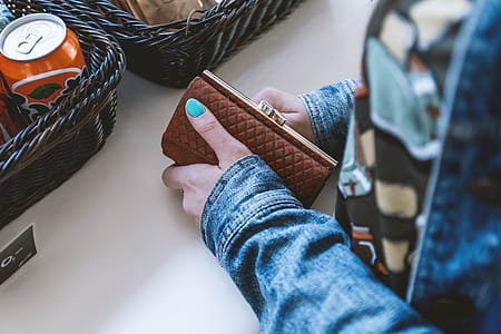 Woman at the checkout with her fashion wallet in hand thumbnail