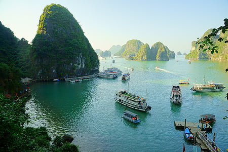assorted-color boats on body of water thumbnail
