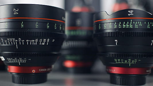 two black-and-red Canon camera lenses thumbnail