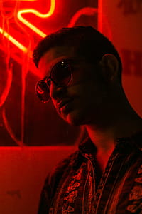 Man in a red-lit room thumbnail