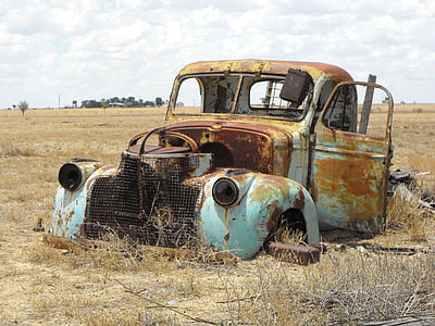 classic teal and brown truck in green grass thumbnail