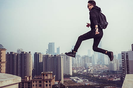 man jumping building gap thumbnail
