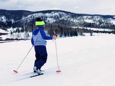 boy holding ice skate poles thumbnail