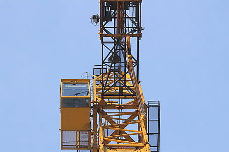 yellow mobile crane control center during daytime low-angle photo thumbnail