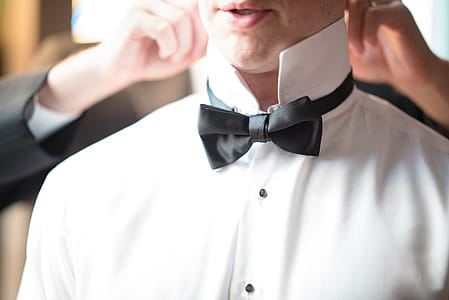 Man In White Collar-top Wearing Black Bow Tie thumbnail