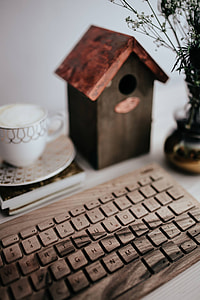 Wooden keyboard and cup of coffee thumbnail
