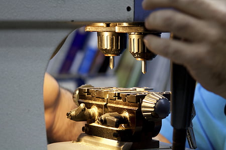 person operating white and black equipment thumbnail