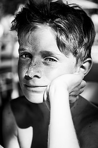 grayscale photo of boy's face thumbnail