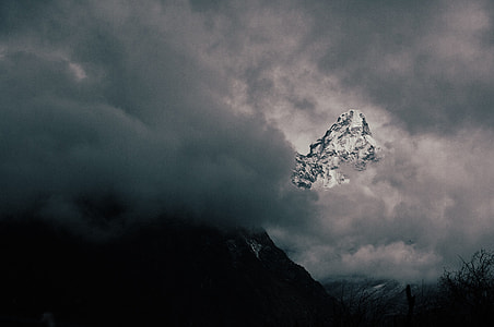 photo of mountain covered with clouds thumbnail