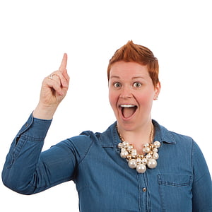 woman in blue dress shirt raising her right hand thumbnail