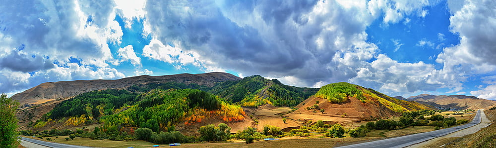 panoramic photo of a green and brown hill thumbnail