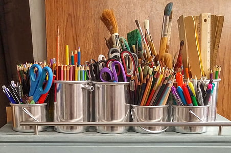 assorted office supplies in grey stainless steel bucket organizers thumbnail