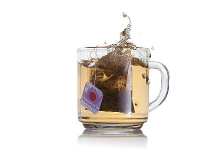 clear glass cup filled with teal thumbnail