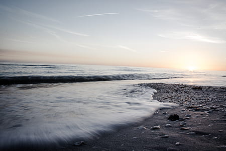 time-lapse photography of water waves on shore thumbnail
