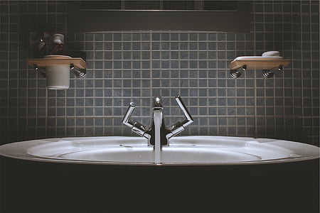 bathtub with soap rack in dark room thumbnail