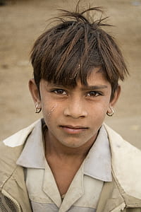 boy wearing hoop earrings thumbnail