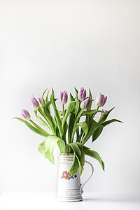 pink lily flowers in white vase thumbnail