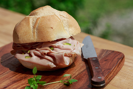 ham sandwich on brown board thumbnail