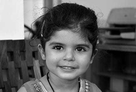 girl in sleeveless top smiling thumbnail