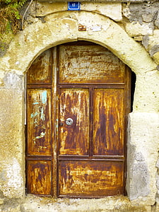 brown and beige metal door during daytime thumbnail