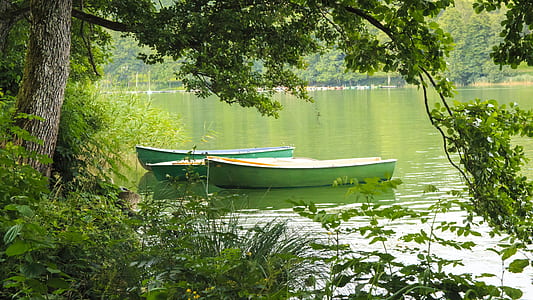 three jon boats on body of water thumbnail