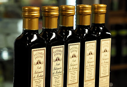 selective focus photography of five brown labeled bottles thumbnail