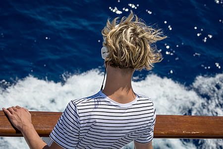 Close-Up Photography of Man Looking Down the Sea thumbnail