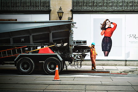 person leaning on gray box truck thumbnail